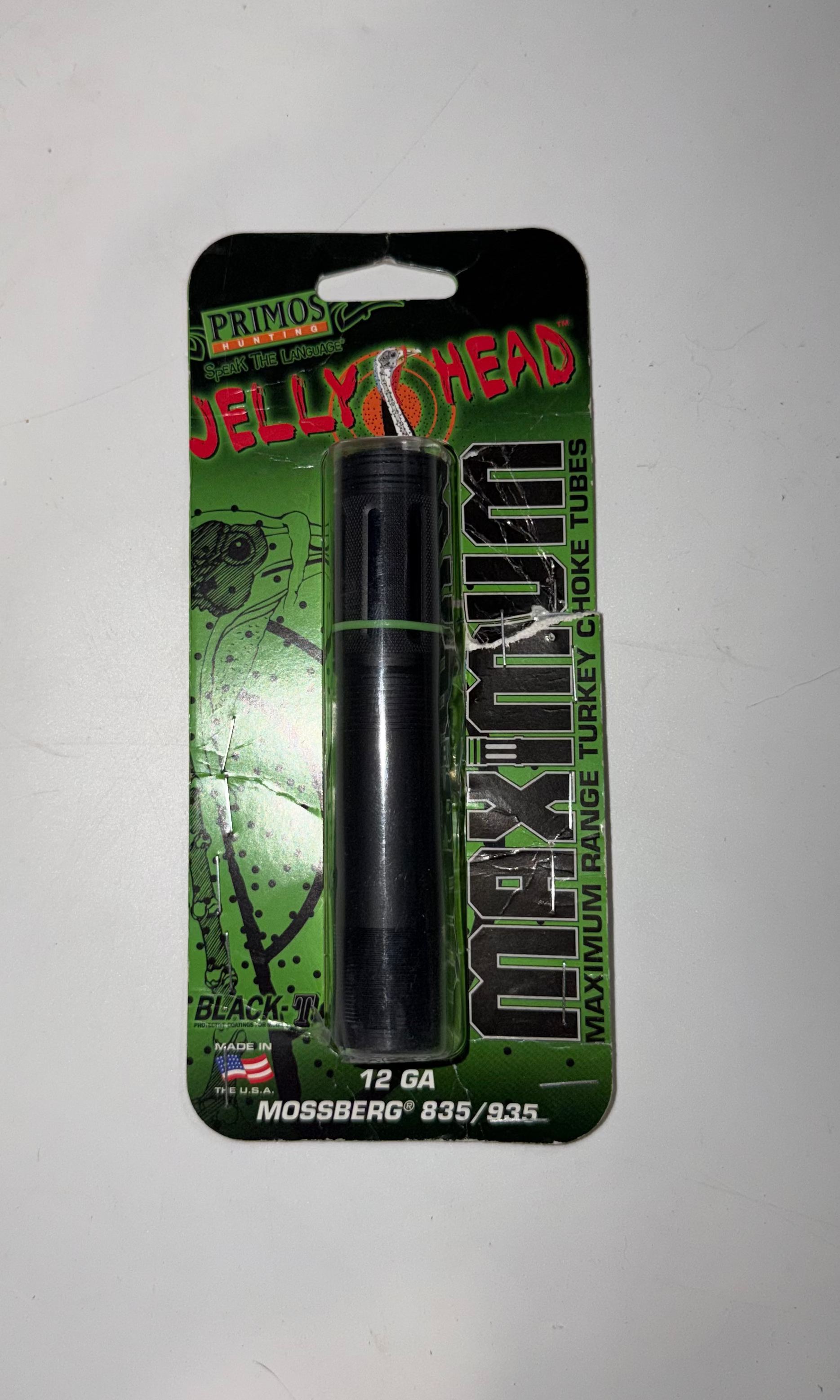 Primos Hunting Jelly Head maximum turkey choke tube installed in Mossberg 835/935 12 gauge shotgun, showing the choke's design.