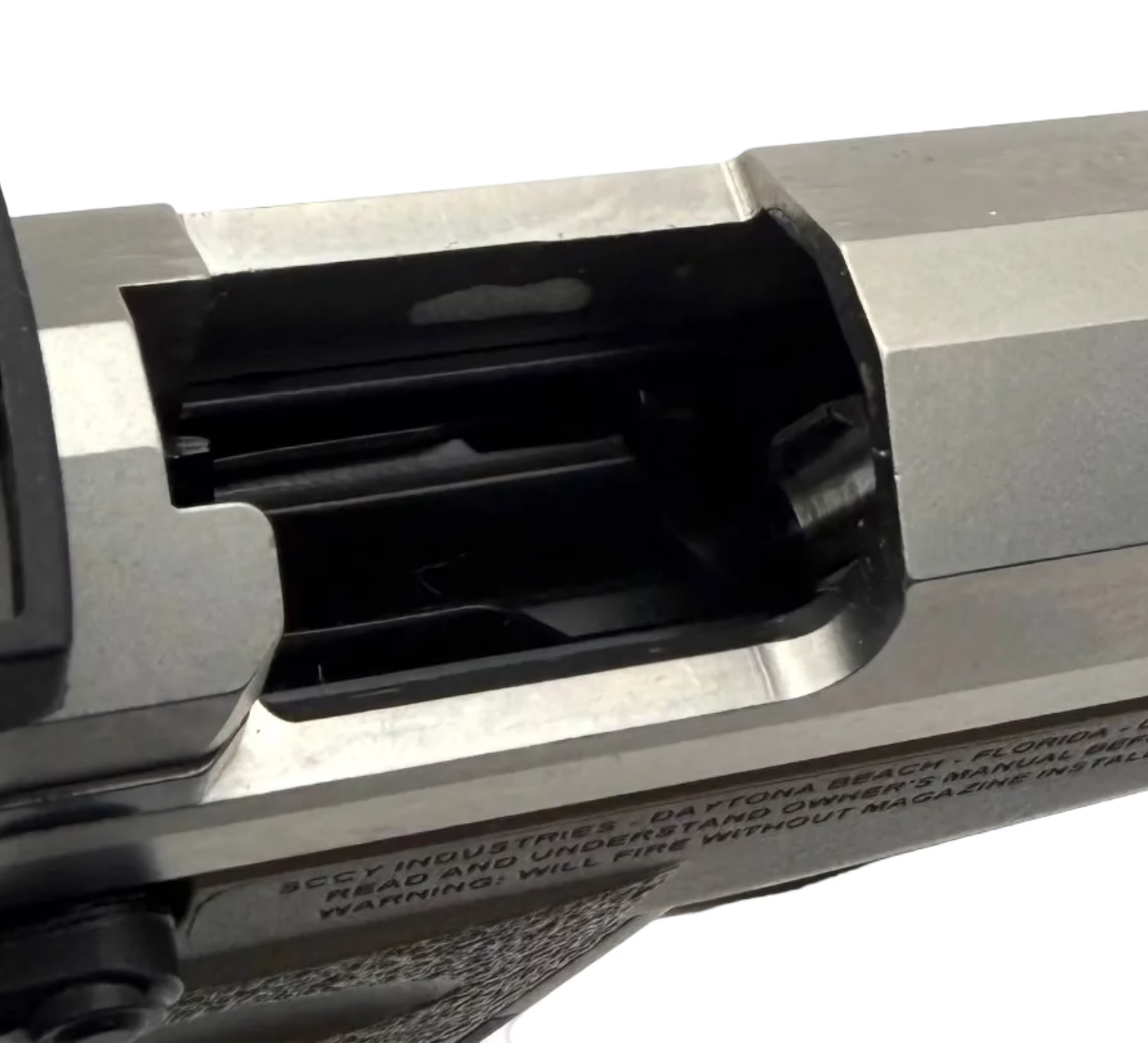 SCCY CPX-1 9mm semi-auto pistol with Crimson Trace red dot sight mounted on black firearm.