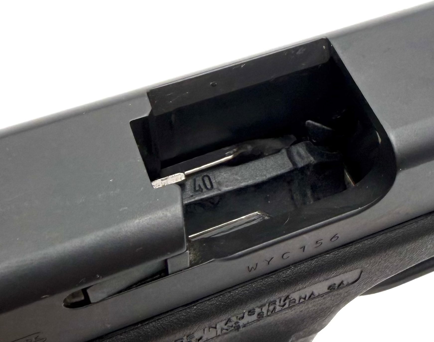 Glock 23 Gen 4 .40 S&W semi-auto pistol shown from the side with black polymer frame and metal slide.