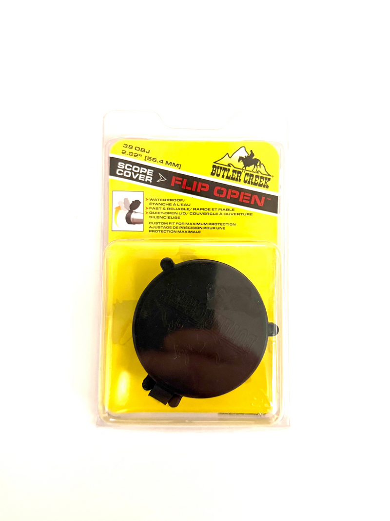 Black round object in a yellow packaging with a label on a white background