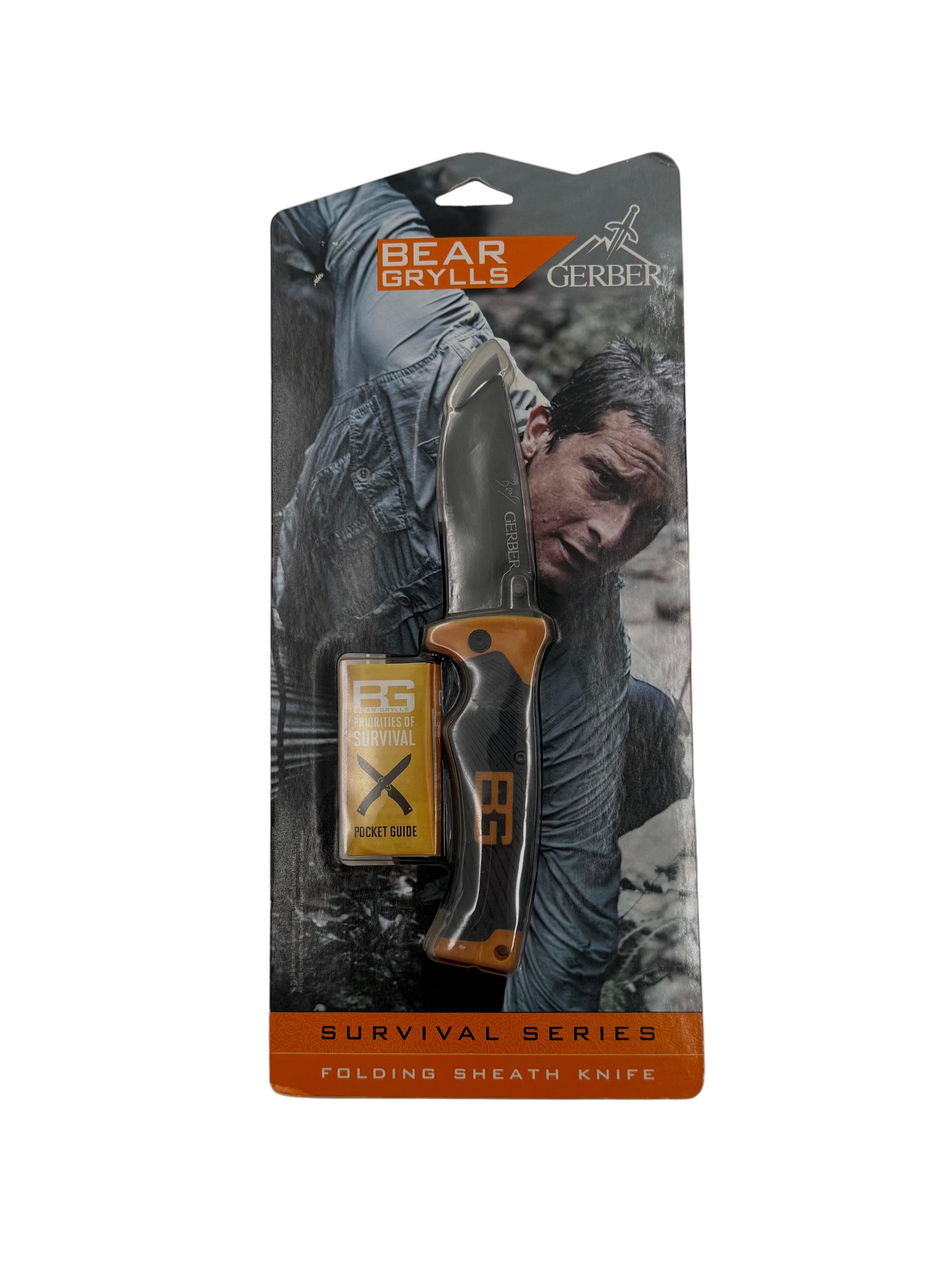 Packaged Gerber Bear Grylls Survival Series folding sheath knife on a gray background