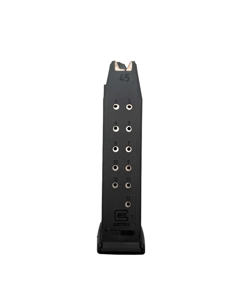 Glock 13-round magazine for G21 and G41 .45ACP pistols, showcasing the metal body and follower in a close-up image.