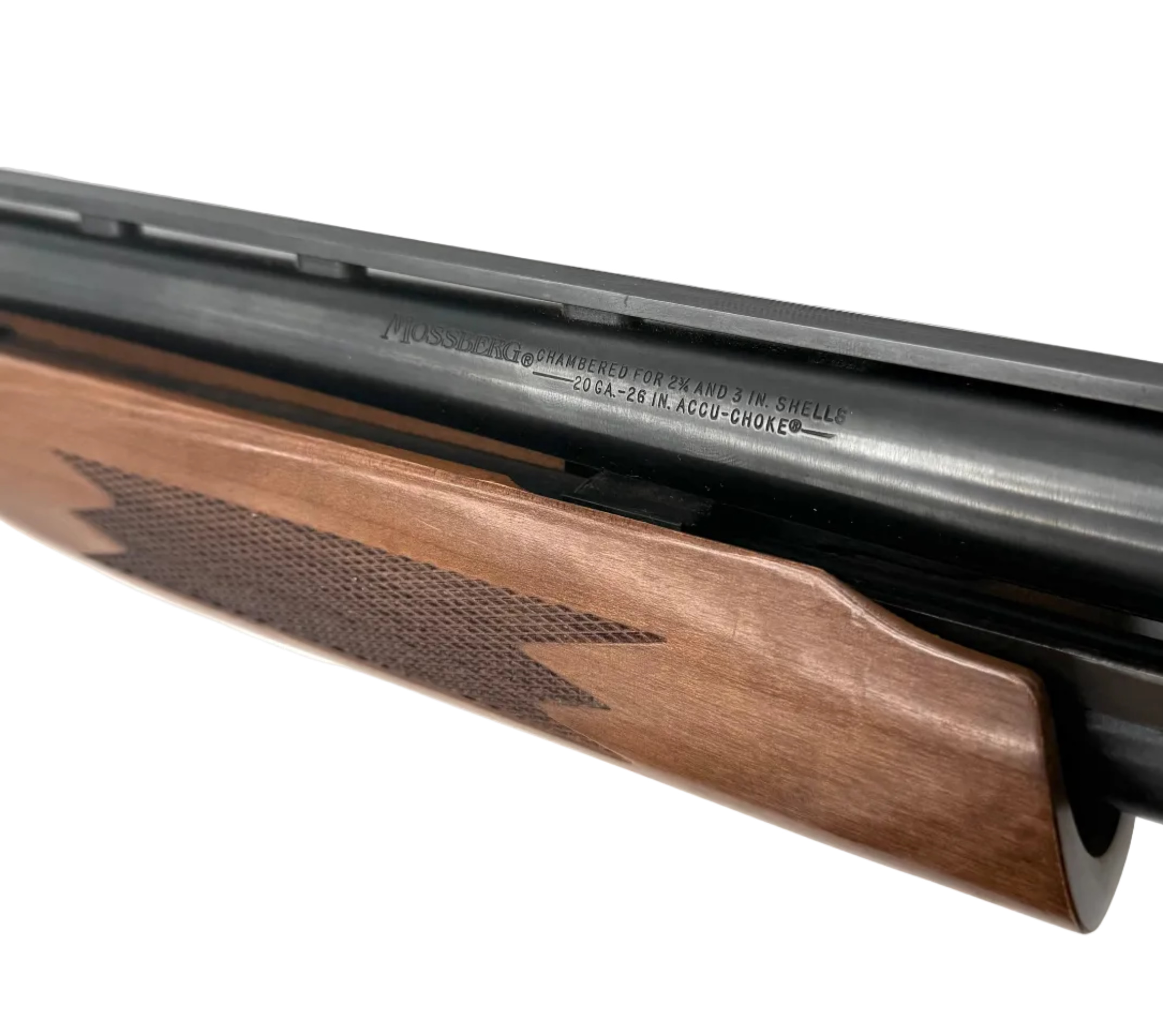 Mossberg Model 500C 20 Gauge pump-action shotgun with a 26-inch barrel, showing the firearm's stock and barrel details.