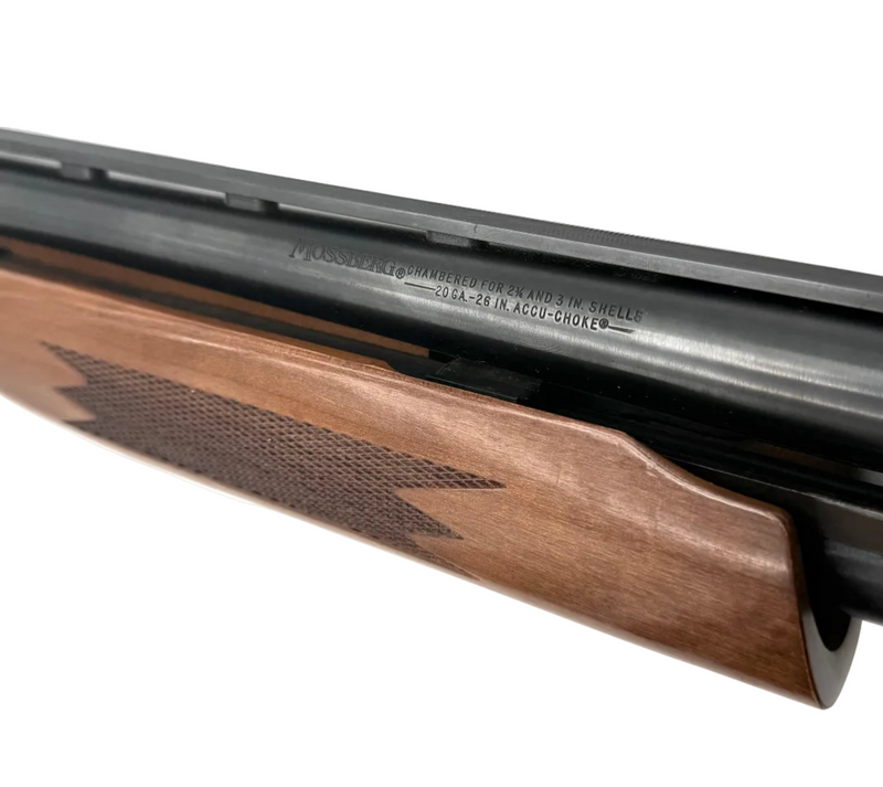 Mossberg Model 500C 20 Gauge pump-action shotgun with a 26-inch barrel, showing the firearm's stock and barrel details.