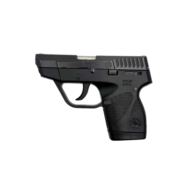 Taurus 738 TCP semi-auto pistol with black polymer grip and stainless steel slide, shown from a side angle.