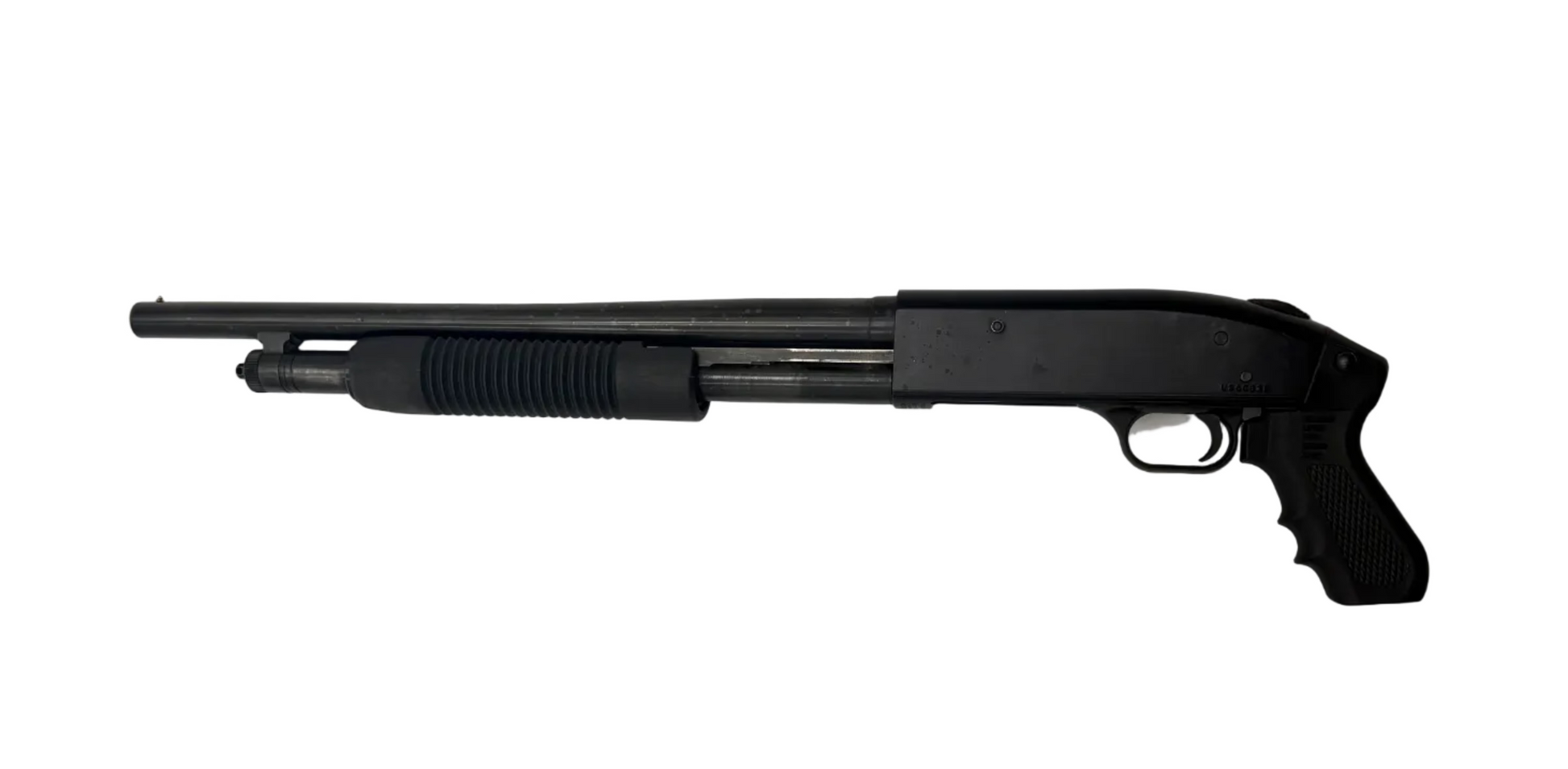 Mossberg 500 Cruiser pump-action 12 gauge shotgun with pistol grip, shown from side angle in a detailed close-up image.