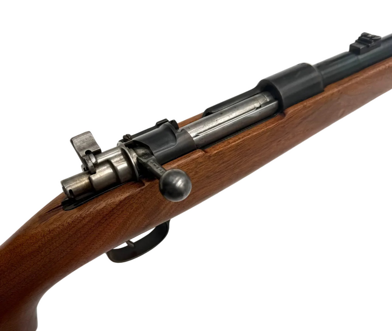 Fabrica De Armas La Coruna 1946 Spanish Mauser bolt action rifle with 7.92x57mm cartridge, shown in a close-up shot.