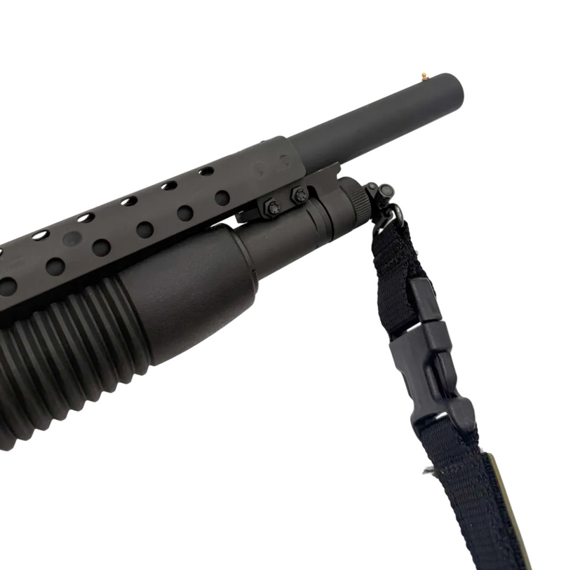 Mossberg 500 12 gauge pump-action shotgun with black synthetic stock and barrel, shown from side view.