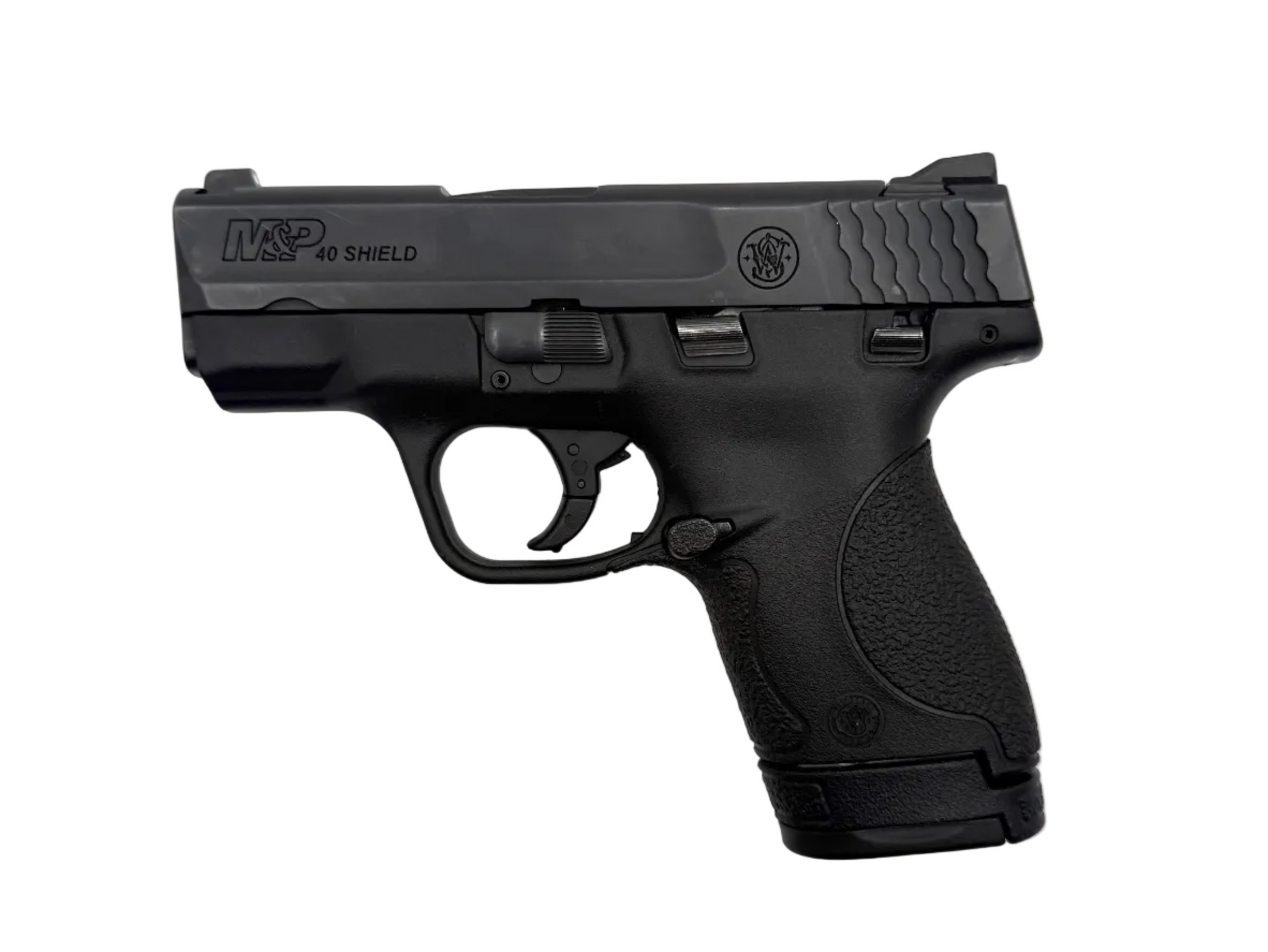 Smith & Wesson M&P 40 Shield semi-auto pistol with black polymer grip and stainless steel slide, shown from side angle.