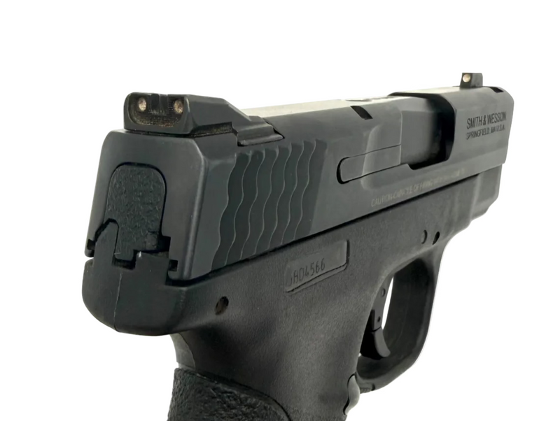 Smith & Wesson M&P 40 Shield semi-auto pistol with black slide and polymer grip, designed for concealed carry and personal protection.