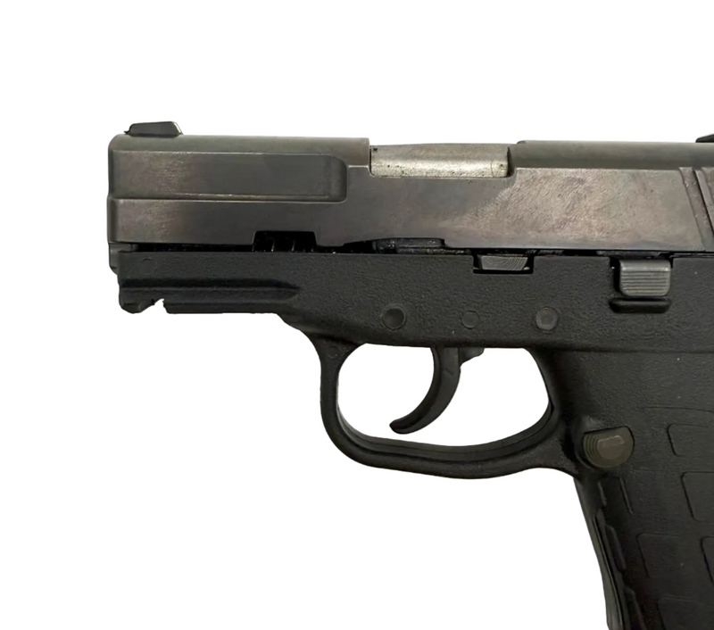 KelTec PF9 9mm semi-auto pistol with black polymer grip and metal slide, shown from a side angle.