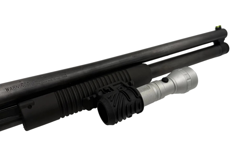 Mossberg Maverick 88 12 gauge pump action shotgun with pistol grip, shown in a close-up image highlighting the firearm's features.