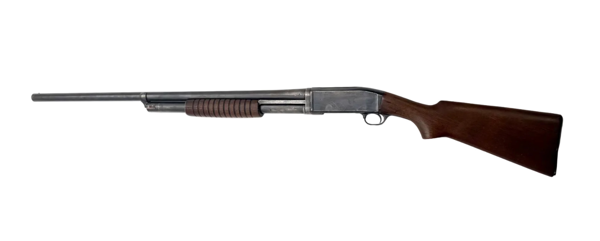 Remington Model 10 12 gauge pump-action shotgun with wooden stock and metal barrel, displayed from side angle.
