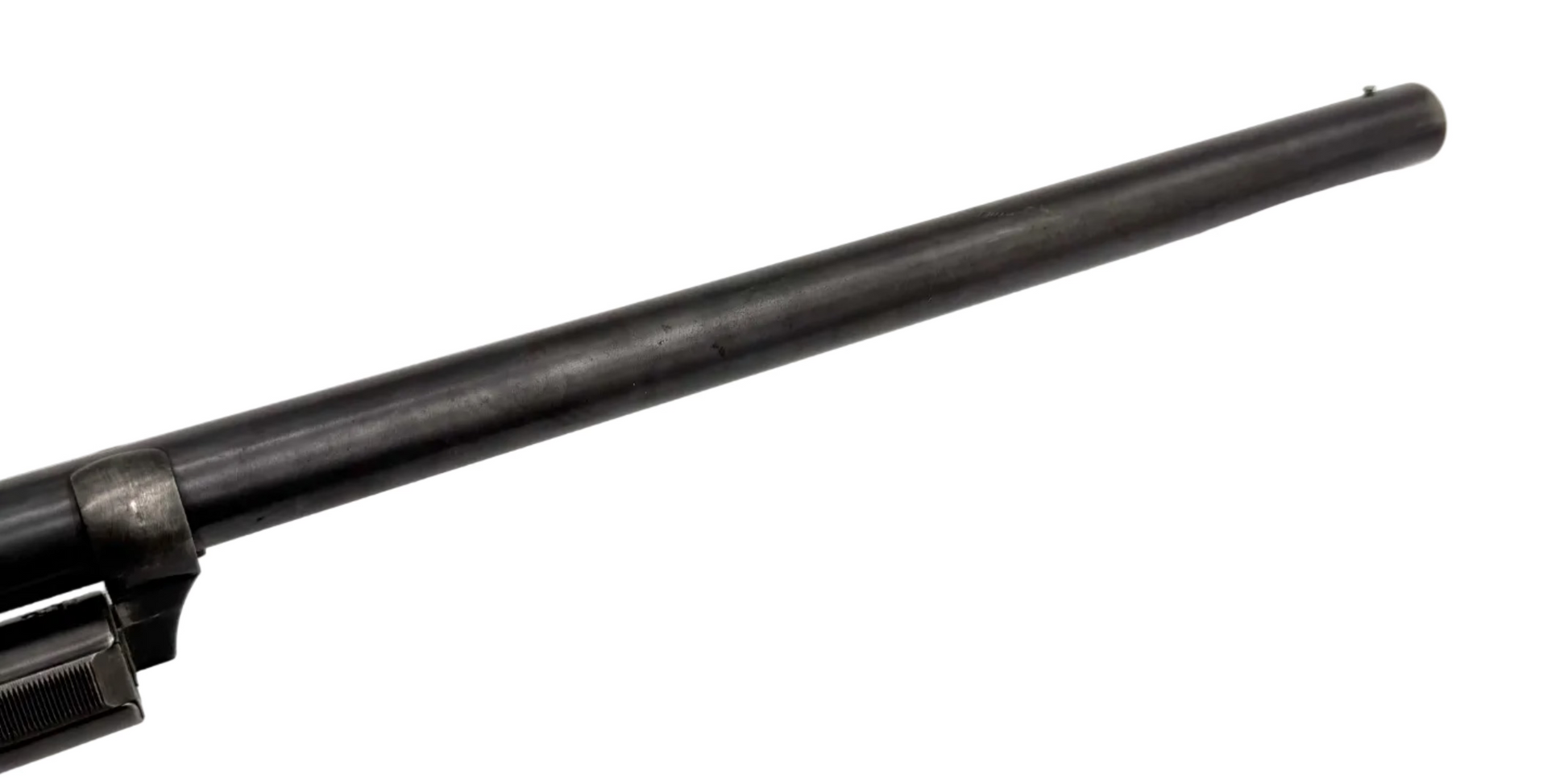 Remington Model 10 12 gauge pump-action shotgun with wooden stock and metal barrel, shown from side view.