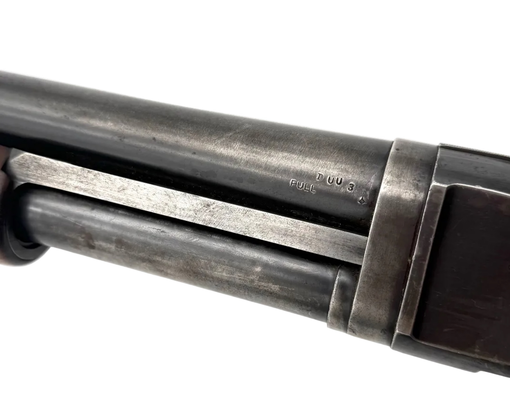 Remington Model 10 12 Gauge pump-action shotgun with wooden stock and metal barrel, ready for hunting or shooting sports.