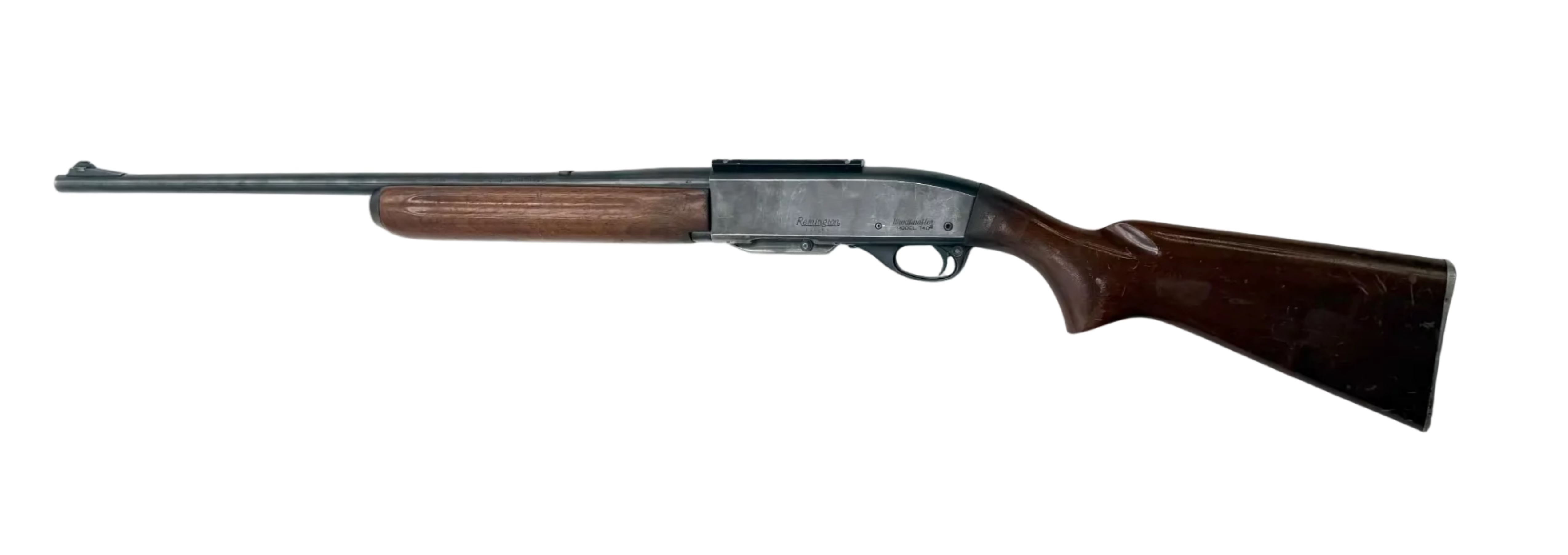 Remington Model 740 .30-06 Springfield semi auto rifle with wooden stock and metallic barrel, shown in a close-up view.