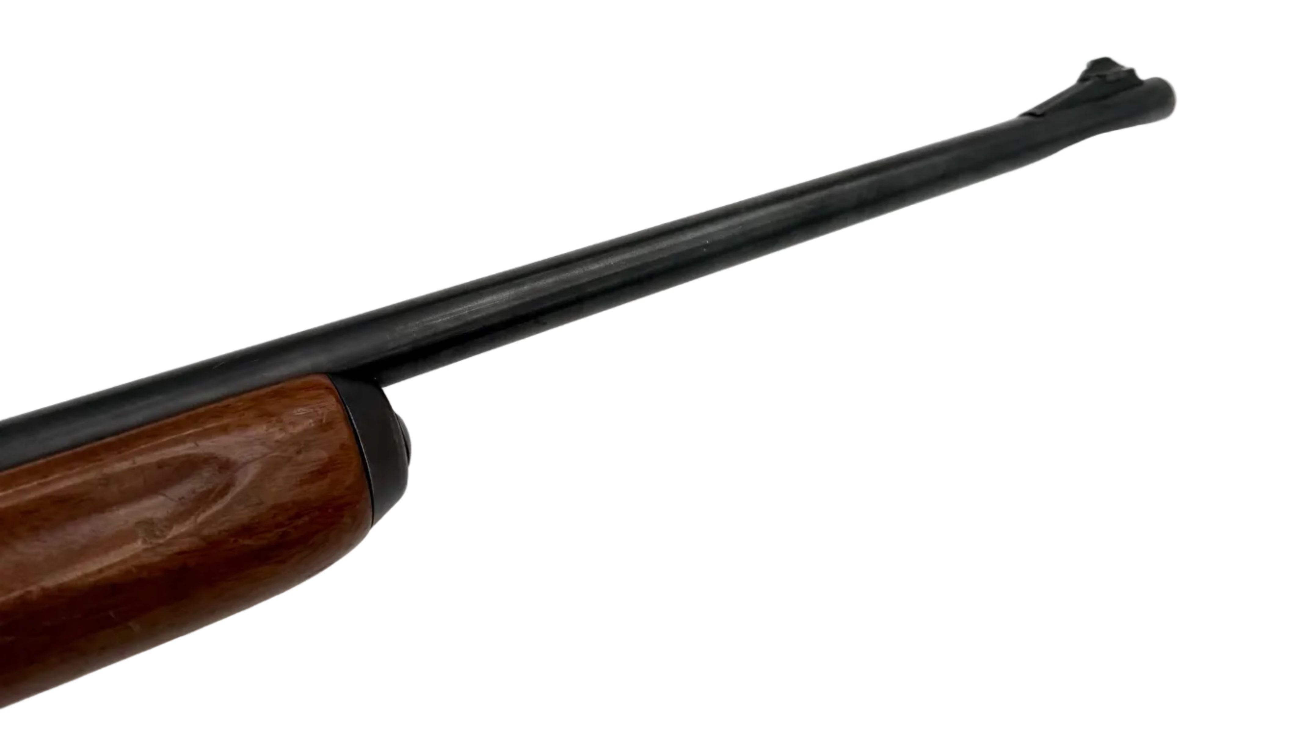 Remington Model 740 .30-06 Springfield semi-auto rifle with wooden stock and metal barrel, featured in the image.
