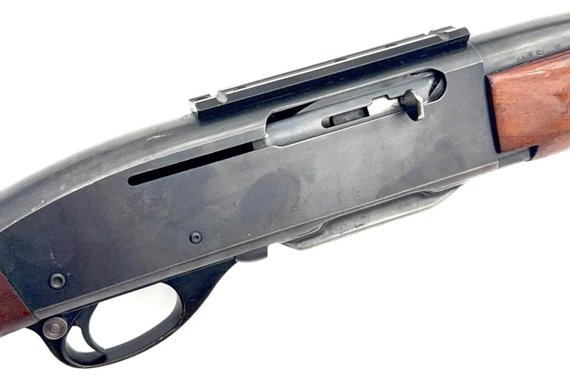 Remington Model 740 .30-06 Springfield semi-auto rifle with wooden stock and metal barrel, displayed on a light background.
