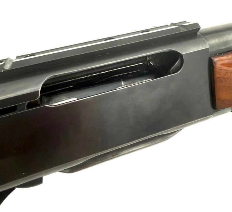 Remington Model 740 .30-06 Springfield semi-auto rifle with wooden stock and metal barrel, displayed on a plain background.