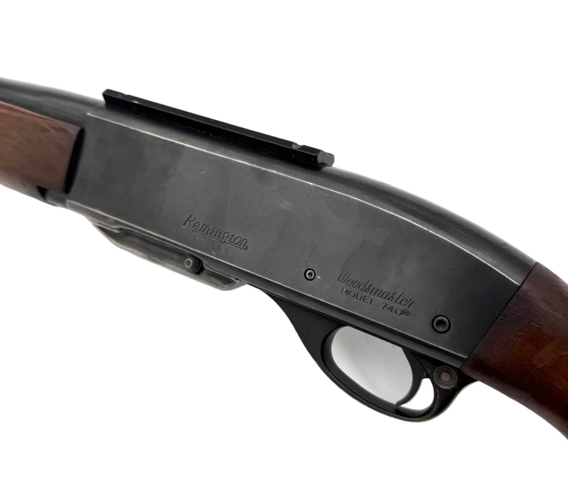 Remington Model 740 .30-06 Springfield semi-automatic rifle with wooden stock and metal barrel, shown from the side in a close-up image.