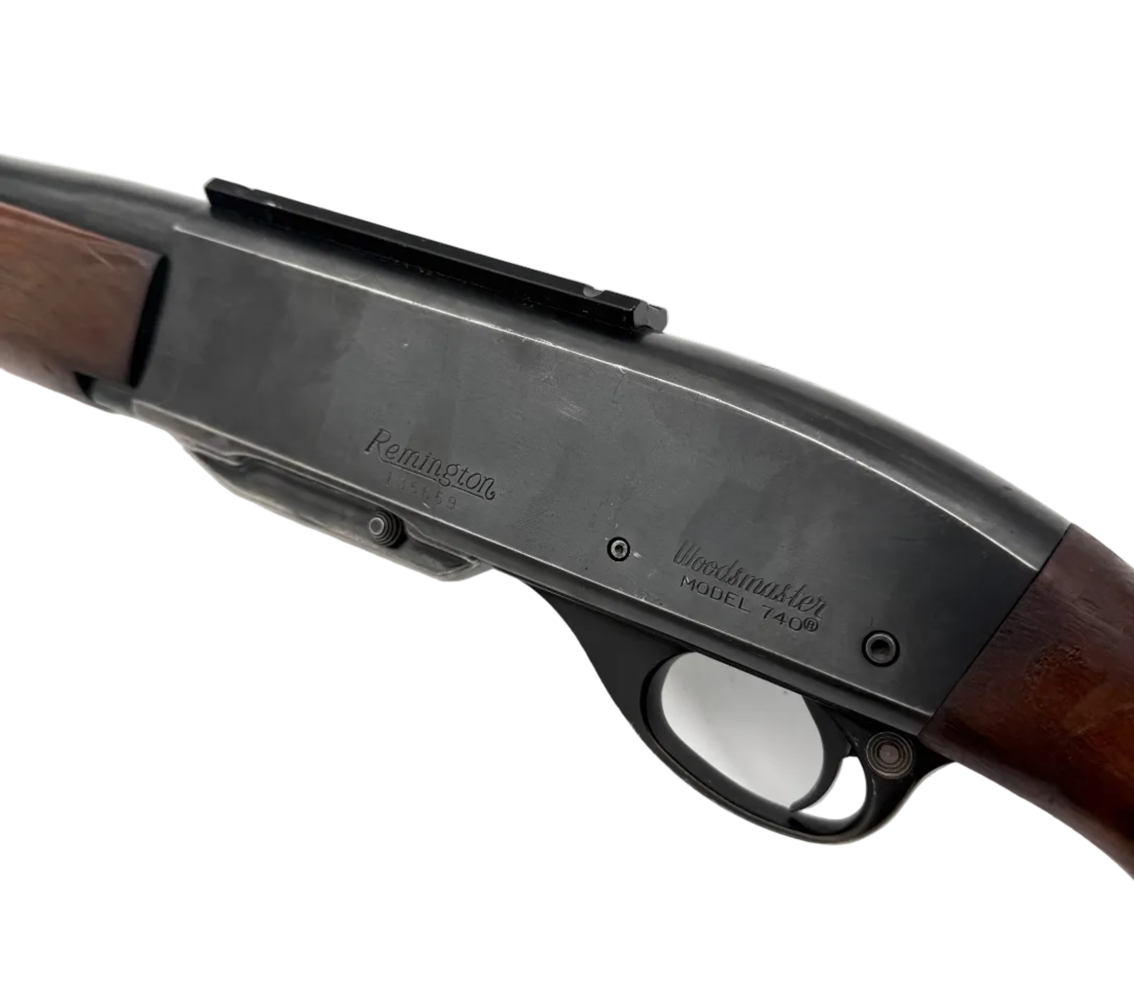 Remington Model 740 .30-06 Springfield semi-automatic rifle with wooden stock and metal barrel, shown from the side in a close-up image.