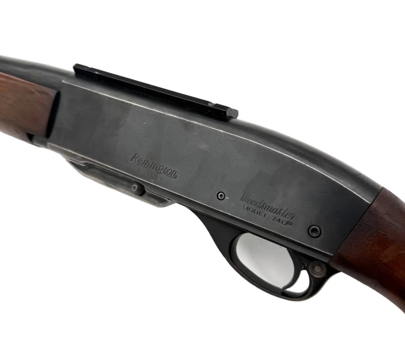 Remington Model 740 .30-06 Springfield semi-automatic rifle with wooden stock and metal barrel, shown from the side in a close-up image.