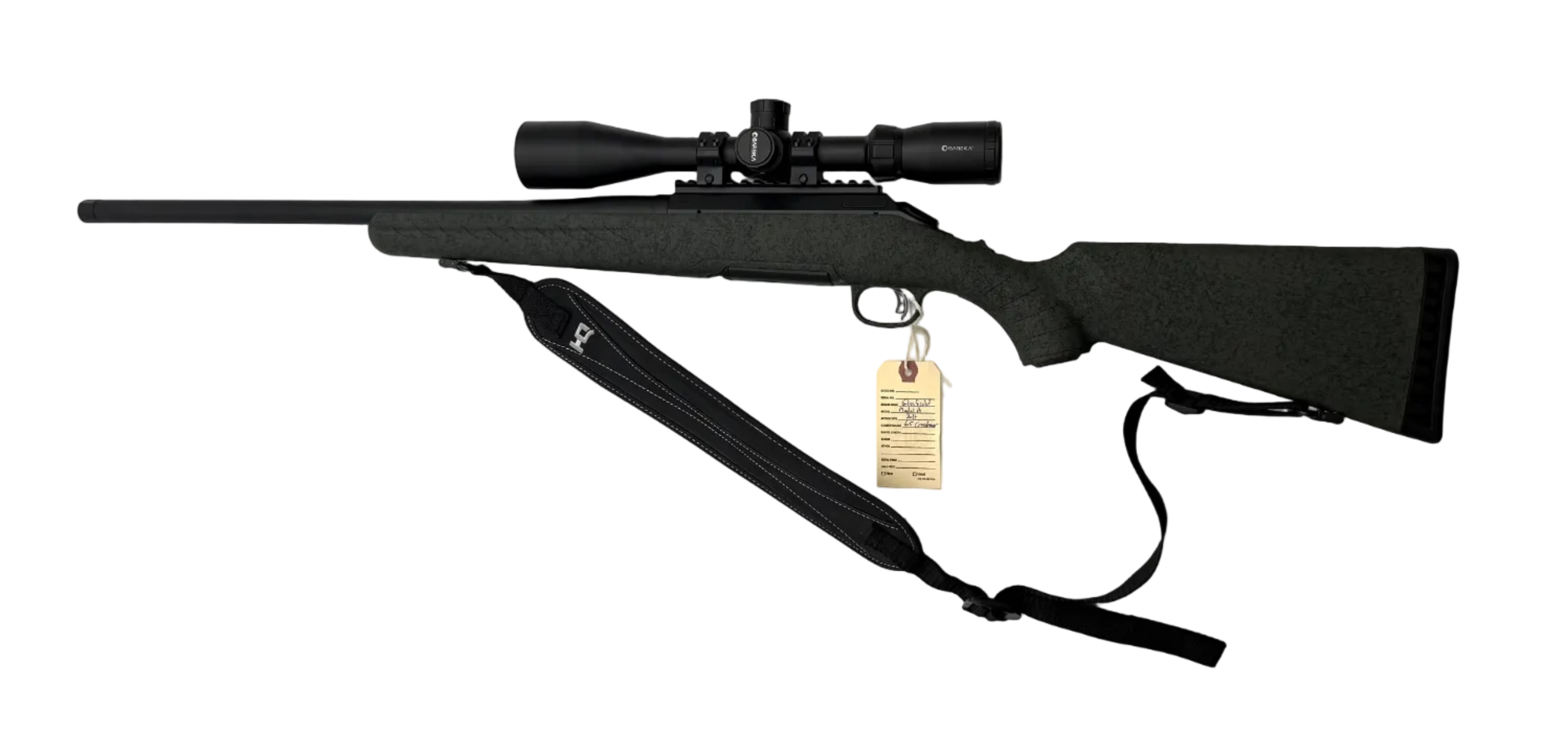 Glenfield Model A bolt action rifle in 6.5 Creedmoor with wooden stock and metal barrel, ready for shooting.